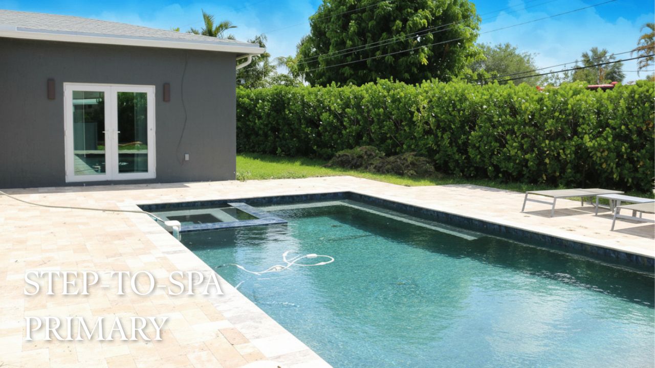 Step-to-spa pool with travertine deck